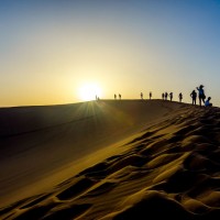 65991016 - silhouette of people on the top of sand dunes gobi desert china